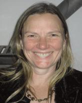 A smiling person in a casual setting.