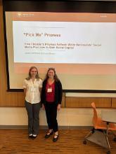SCU faculty and student in front of a presentation screen at a conference