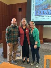 3 SCU faculty presenting in a large room