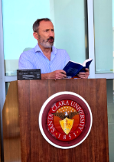 Provost James Glaser reading at the Homer-athon.