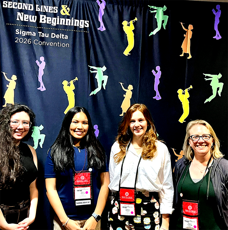 Sigma Tau Delta members  Audrey Mei-Lin Backof, Malia Garcia, Sophie Copple, with faculty advisor Maria Judnick.