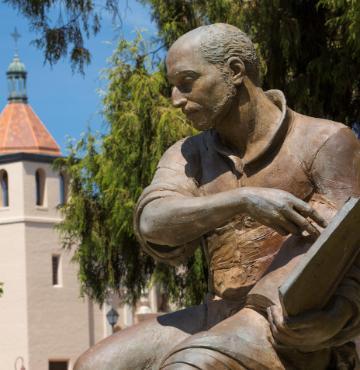 St. Ignatius Statue with Mission Church in background