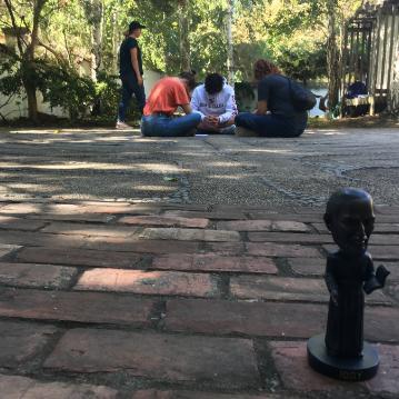 Reflecting in circle with St. Ignatius bobblehead