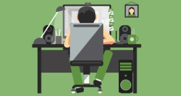 Person working at a desk with a computer at home.