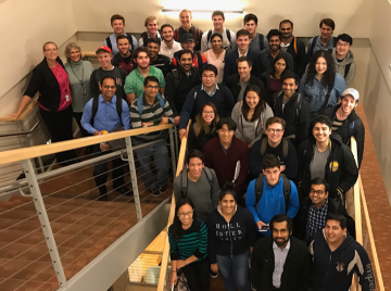 Large group of people posing on stairs at VCIC 2017 event.
