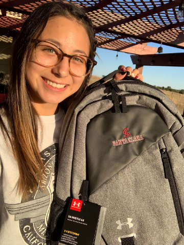 Photo of MOBI student with SCU backpack