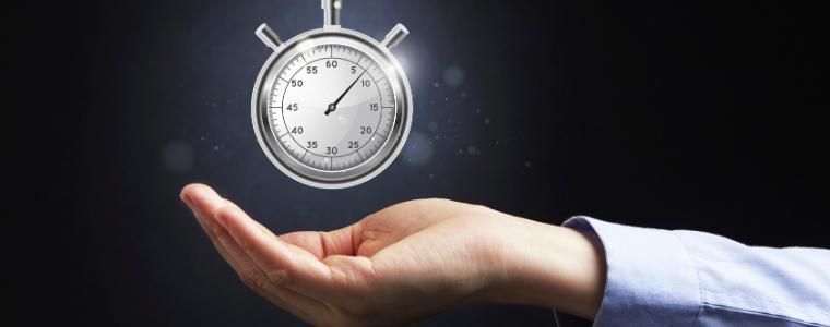 Photo of hand holding stopwatch