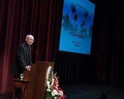 Fr. Michael Engh speaking from podium.