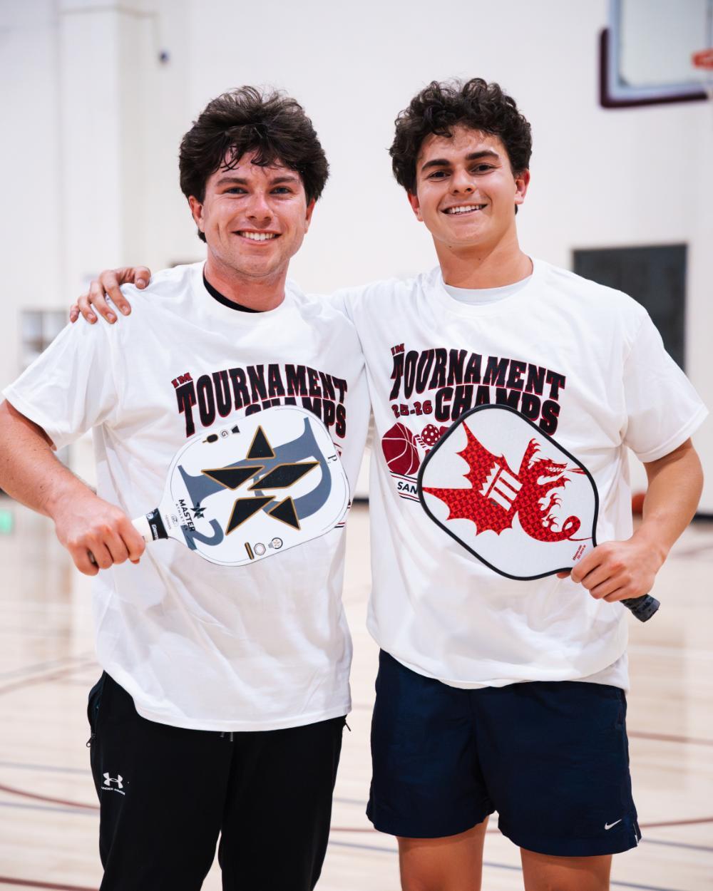 2 people on the saturn with their IM tournament shirts