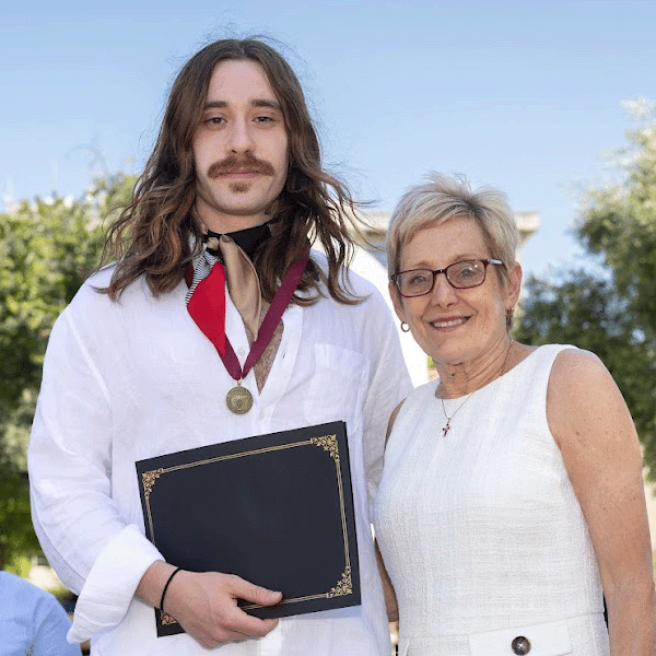 Valedictorian Simon Lanzoni and SCU President Julie Sullivan