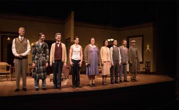 Awake and Sing! cast members on stage in period costumes. 