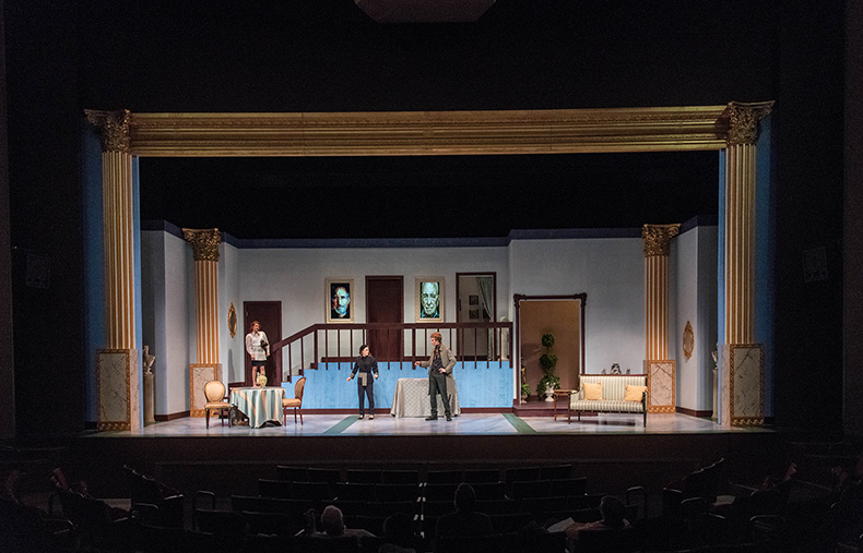 A stage scene from a play, Tartuffe, with actors performing.