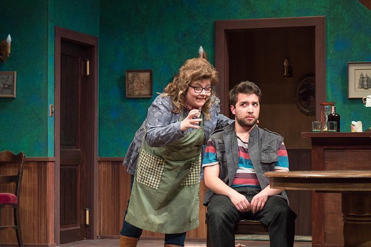 Two actors performing a scene in The Foreigner play.
