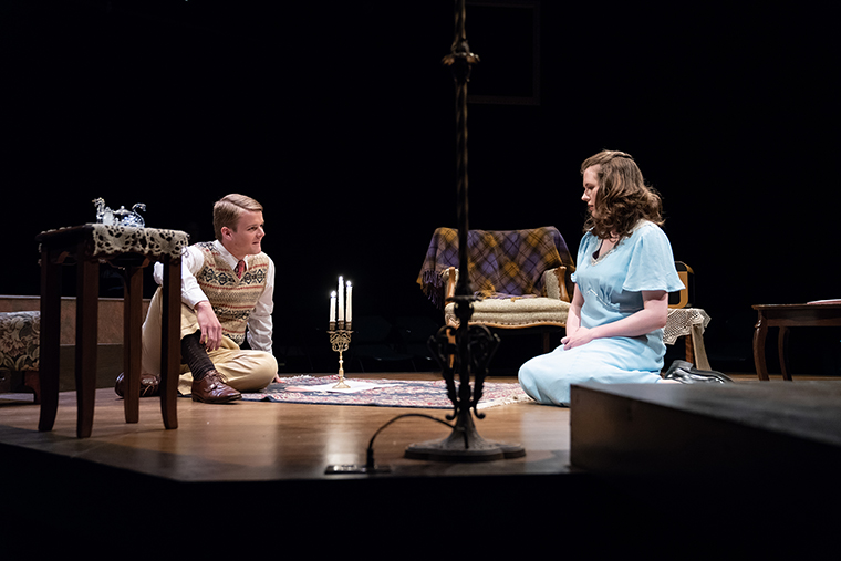Two actors perform on stage in The Glass Menagerie.