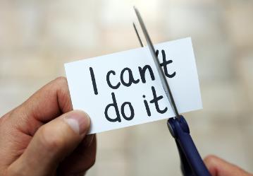 A paper with text I can’t do it being cut to say I can do it.