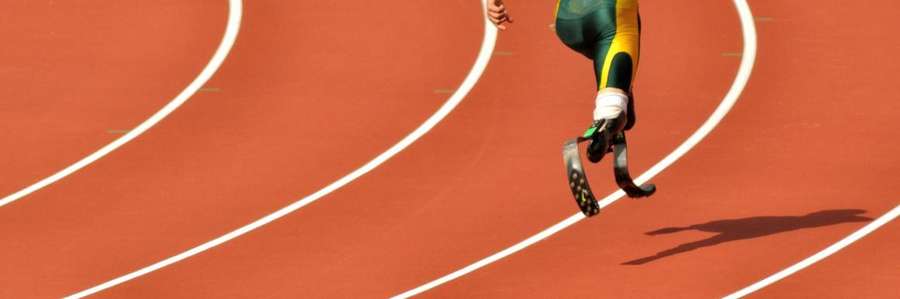 A person running on a track lane.