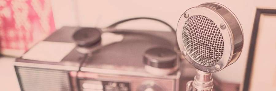 Cartoon person looking surprised while holding a megaphone.