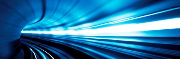 Blue and white light beams in a tunnel-like structure.